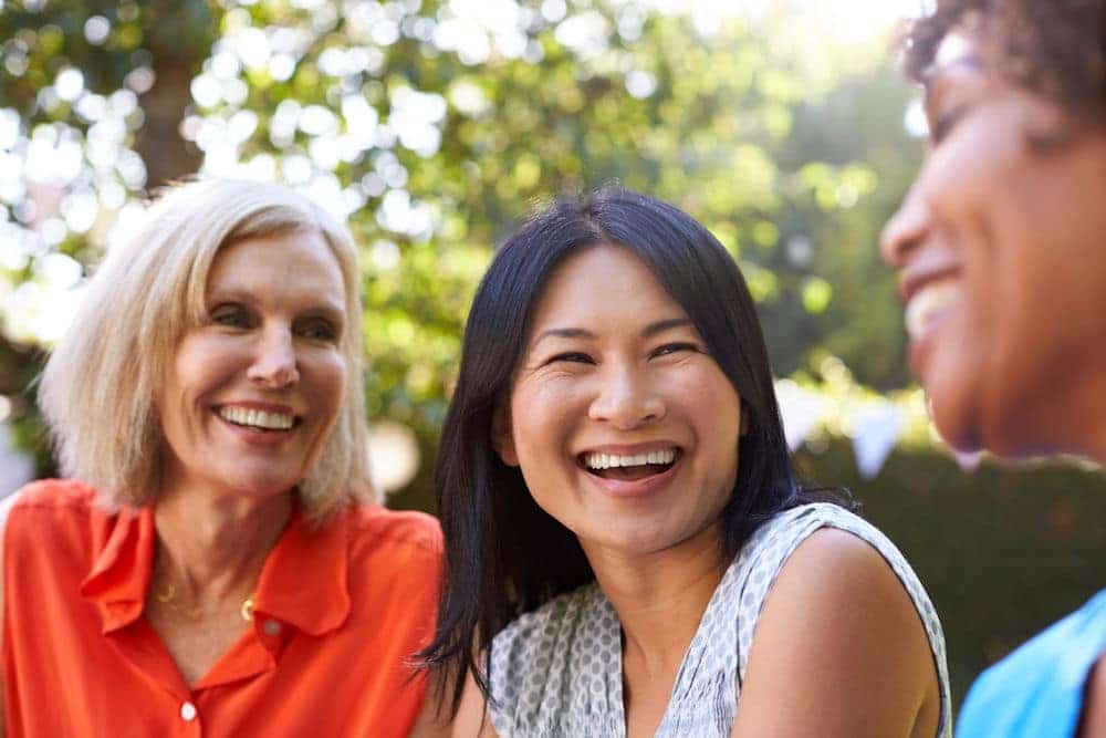 group of women outside laughing