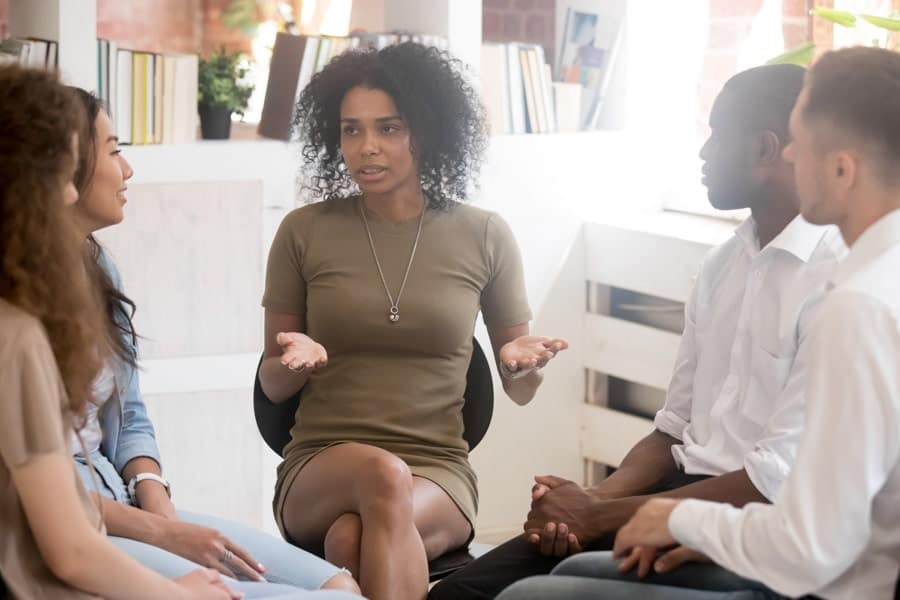 woman with group in therapy