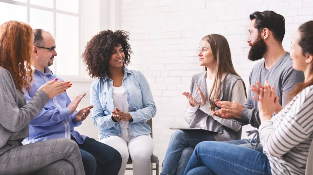 happy group sitting in circle