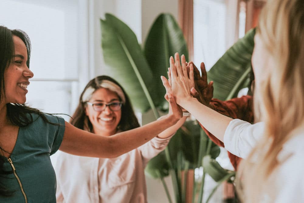 group high five in therapy