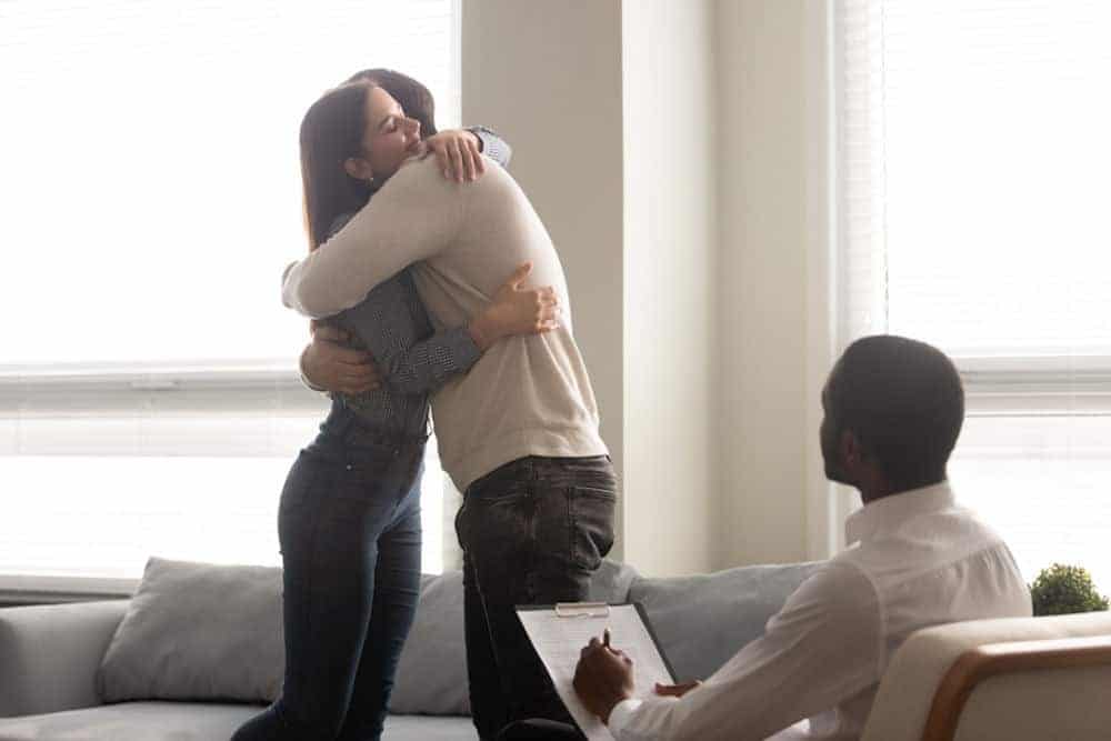 couple hugging in therapy